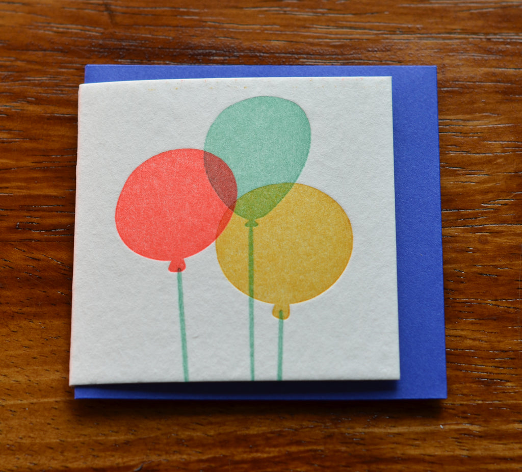 Cream card with neon balloons