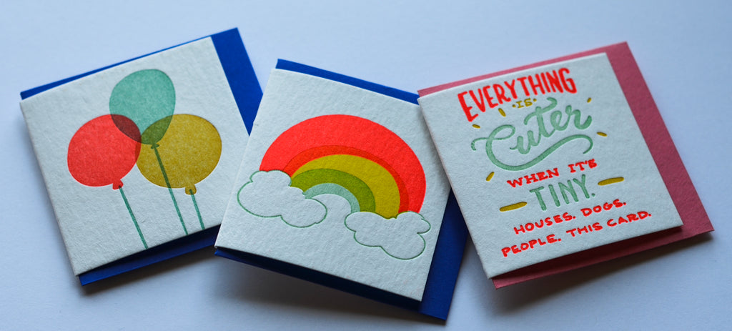 Three small cards with vibrant images