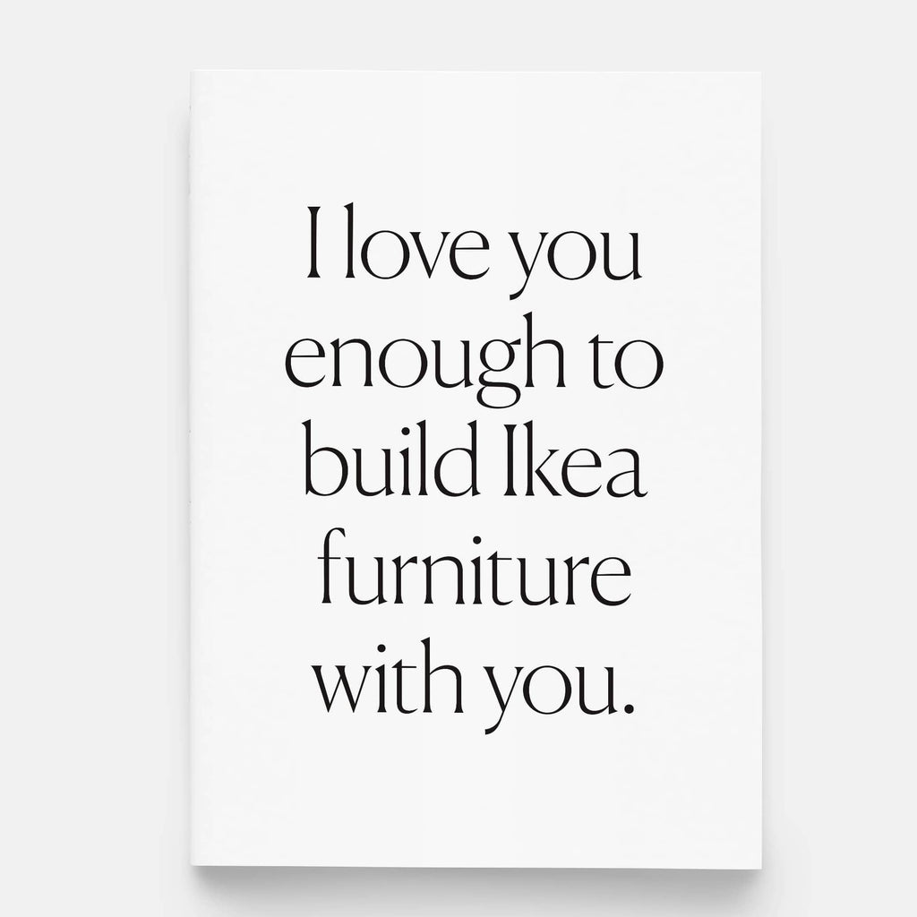 White greeting card with black lettering that says I love you enough to build Ikea furniture with you