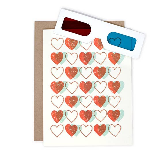 greeting card with hearts on the front printed in blue and red ink, 3-D glasses