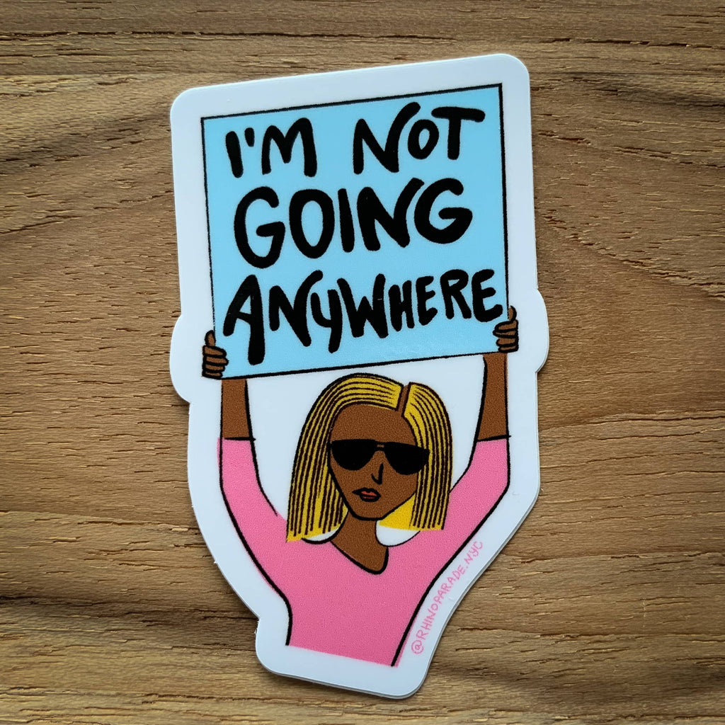 Vinyl sticker with illustrated woman in pink shirt holding sign that says I'm not going anywhere 