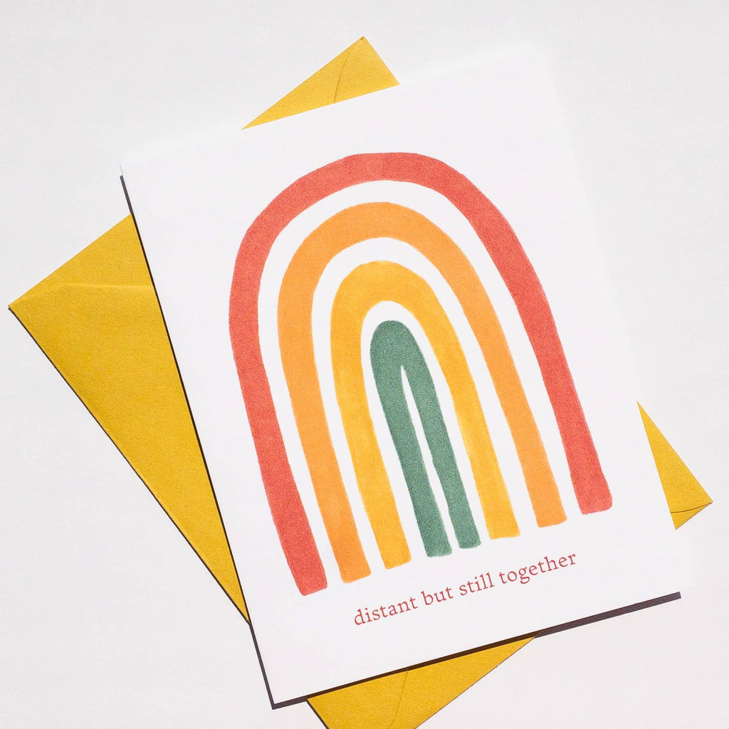 greeting card with rainbow and distant but still together text
