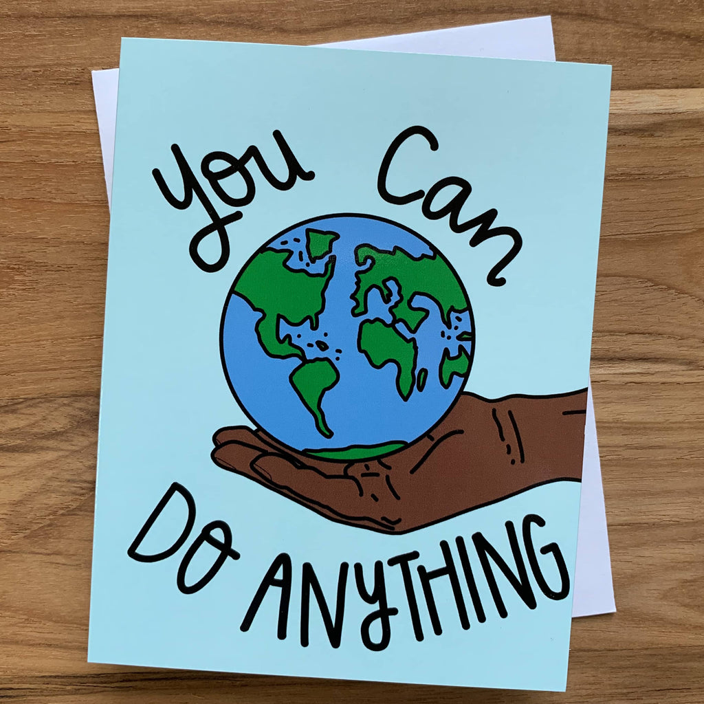 You Can Do Anything Card featuring a dark brown hand holding the world